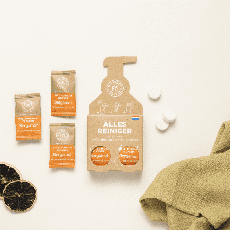 Eco-friendly multi-purpose cleaning tablets with bergamot scent by The Green Lab Co – pack of 3 refills shown with white tablets, dried citrus and cleaning cloth on a neutral background.